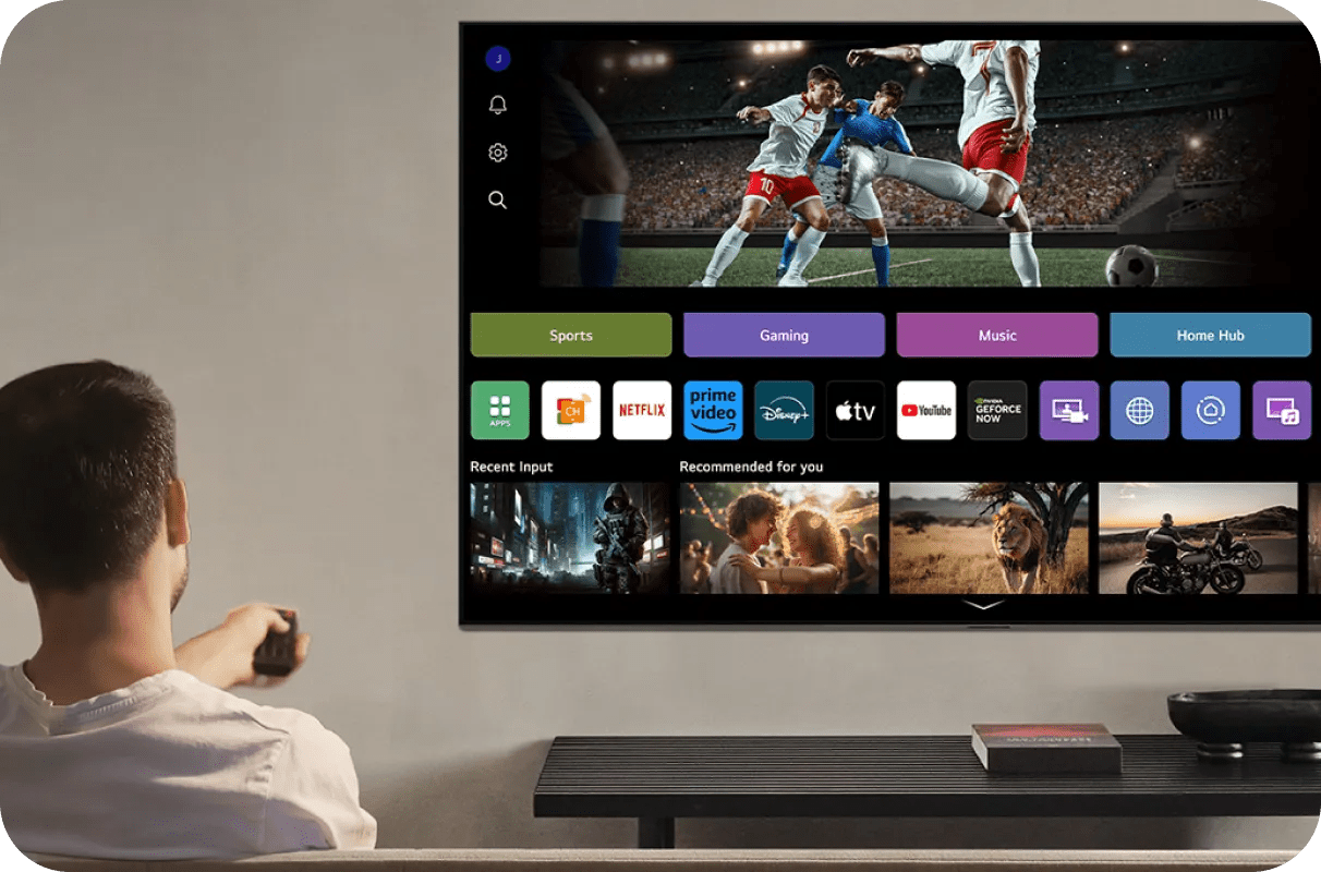 Man browsing the LG webOS interface with sports, gaming, streaming apps and personalized recommendations.