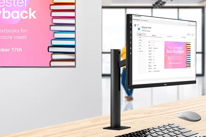 LG Computer monitor on a desk, displaying ConnectedCare DMS management system on its screen. The image inside of the CMS is also on an LG Digital Signage display on the wall.