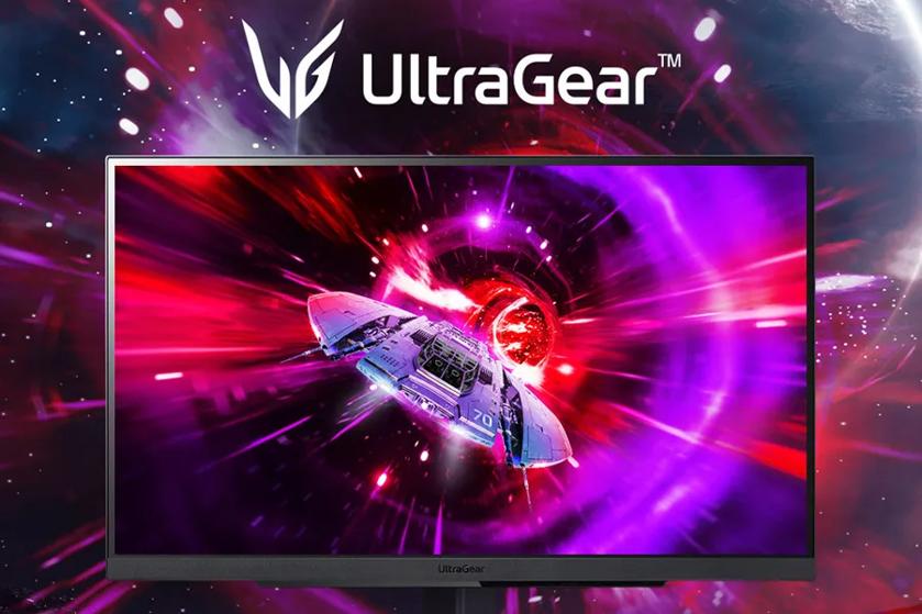 A computer monitor displays a spaceship flying into a colorful space vortex, with the UltraGear brand above.