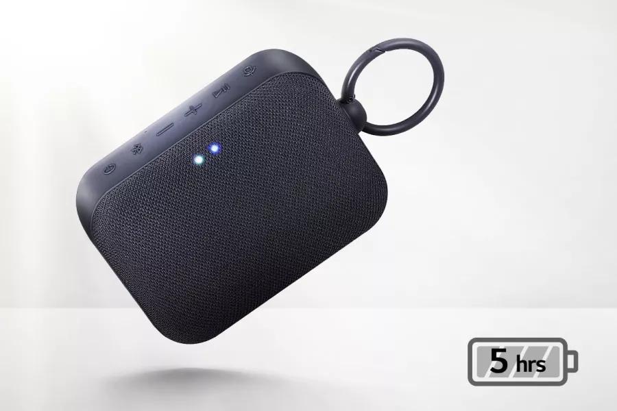 A front view of LG XBOOM Go floating at an angle Light coming from the behind