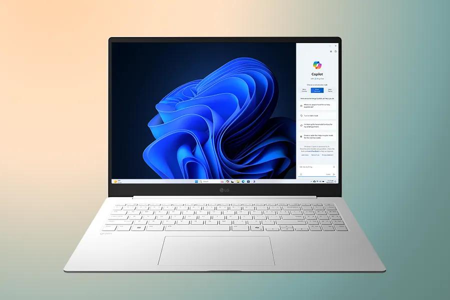 This image shows a laptop displaying a clear Windows 11 screen on a gradient background with a copy of "Upgrade your Efficiency."