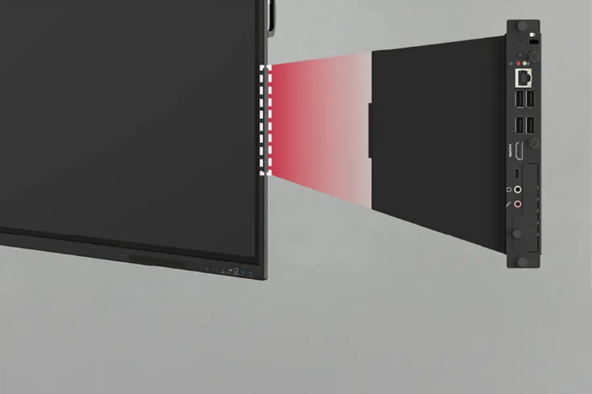 A monitor with a connected black module featuring various ports and a red gradient indicating connectivity.