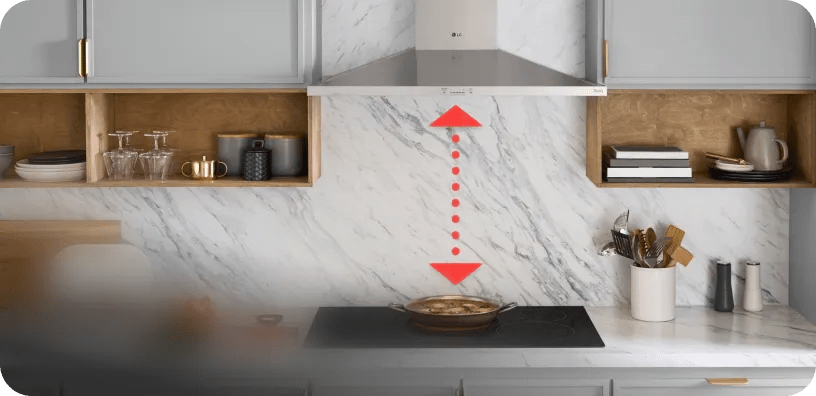 A red arrow spans the distance between an LG cooktop and LG hood to indicate syncing in a modern kitchen.