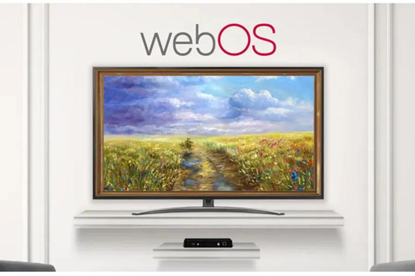 An LG OLED TV that looks like a framed landscape painting beneath the "webOS" logo on a light-colored wall.