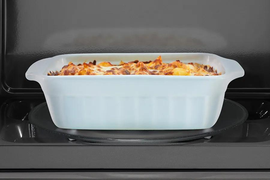 Open microwave door showing dish inside