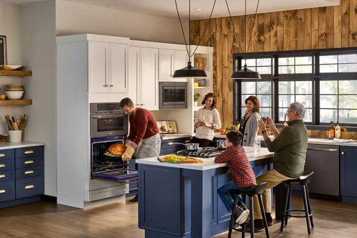 Family in kitchen preparing dinner