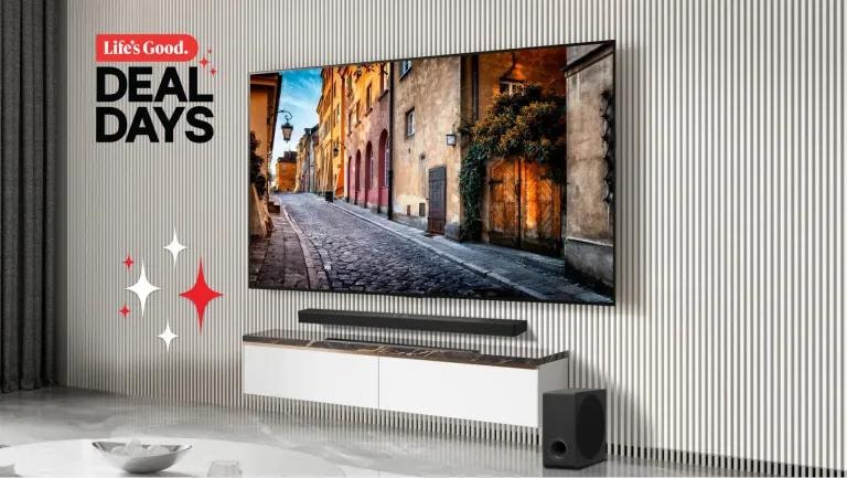 Life's Good. Deal Days -- LG TV mounted on a striped wall above a floating media console with an LG Soundbar and subwoofer below, decorative sparkle accents on the left