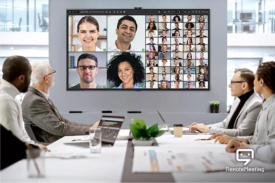 A video conference with multiple people on screen.