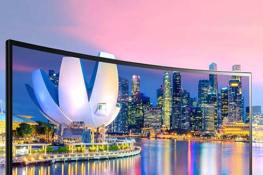 Display showing a cityscape with a lotus-shaped building and skyscrapers at sunset.