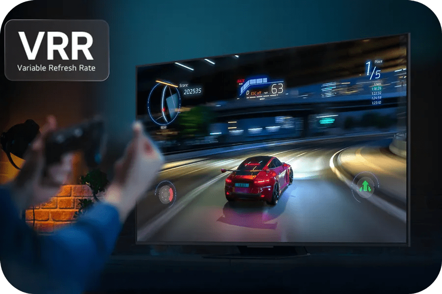 Person playing racing game with controller; LG TV shows clear fast-moving car with VRR for smoother, tear-free gameplay.