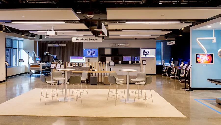 Conference area at the LG LA Business Innovation Center, with two sleek modern table and chair sets in a central area between the various healthcare zones of the BIC.