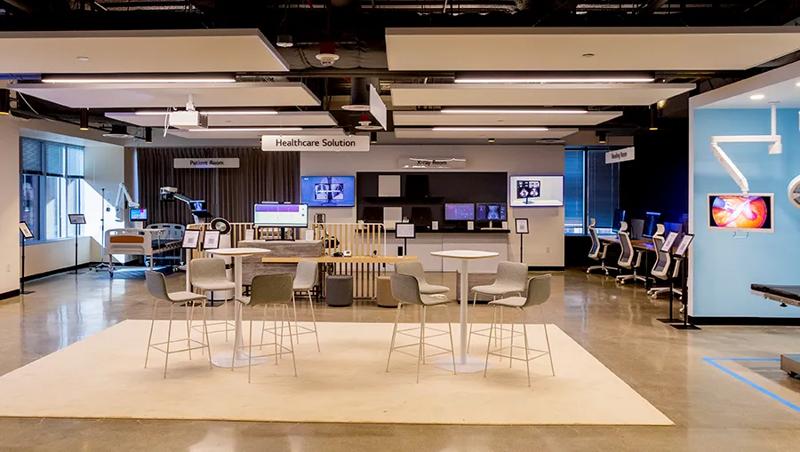 Conference area at the LG LA Business Innovation Center, with two sleek modern table and chair sets in a central area between the various healthcare zones of the BIC.