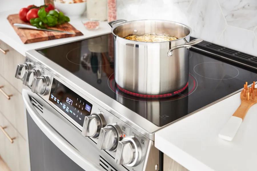 Cooktop boiling 9-inch cookware with pasta