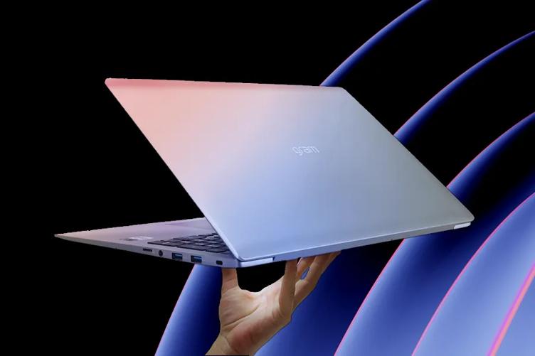 A hand holds up an LG gram laptop on a purple and pink abstract background