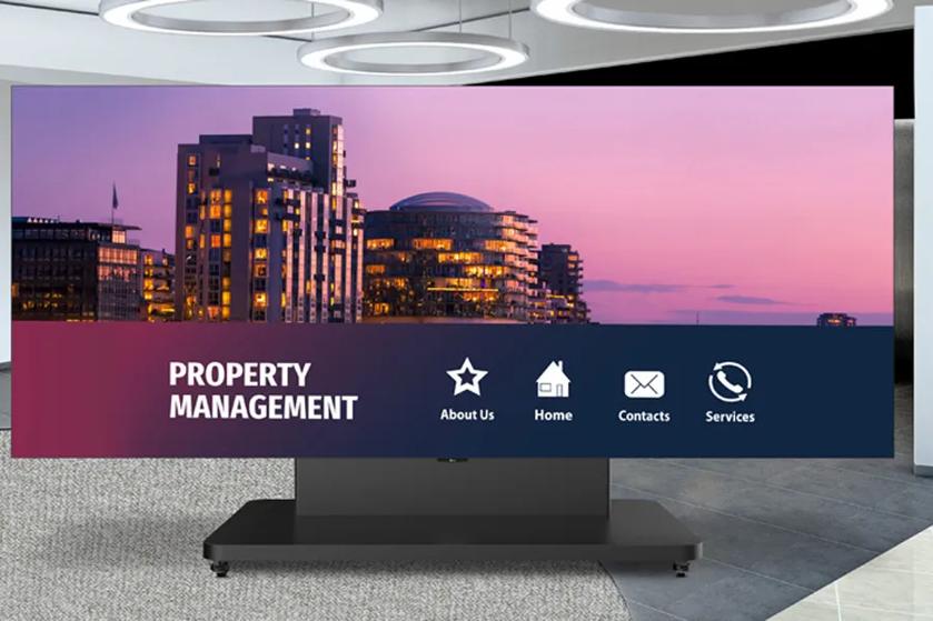 Screen displaying a property management cityscape with icons for About Us, Home, Contacts, and Services.