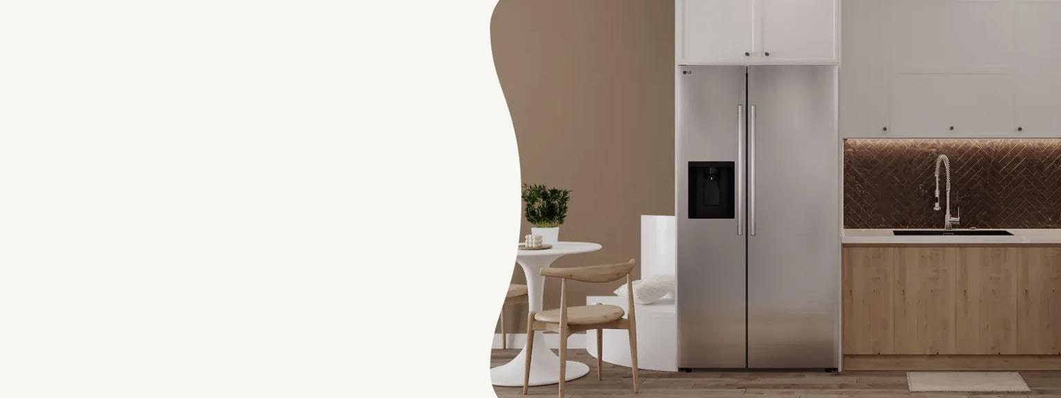A stainless steel LG side-by-side refrigerator is centered in a minimalist kitchen with light wood lower cabinets and a dark brown herringbone tile backsplash. The space is complemented by a small white dining set and neutral brown walls, creating a clean, modern aesthetic.