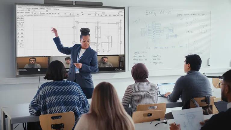 An instructor gives a lesson to adult learners with LG CreateBoard