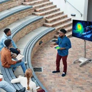 A professor uses an LG display to teach a class.
