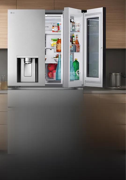 LG refrigerator with the Door-in-Door panel open, showing organized snacks and drinks inside a modern kitchen.