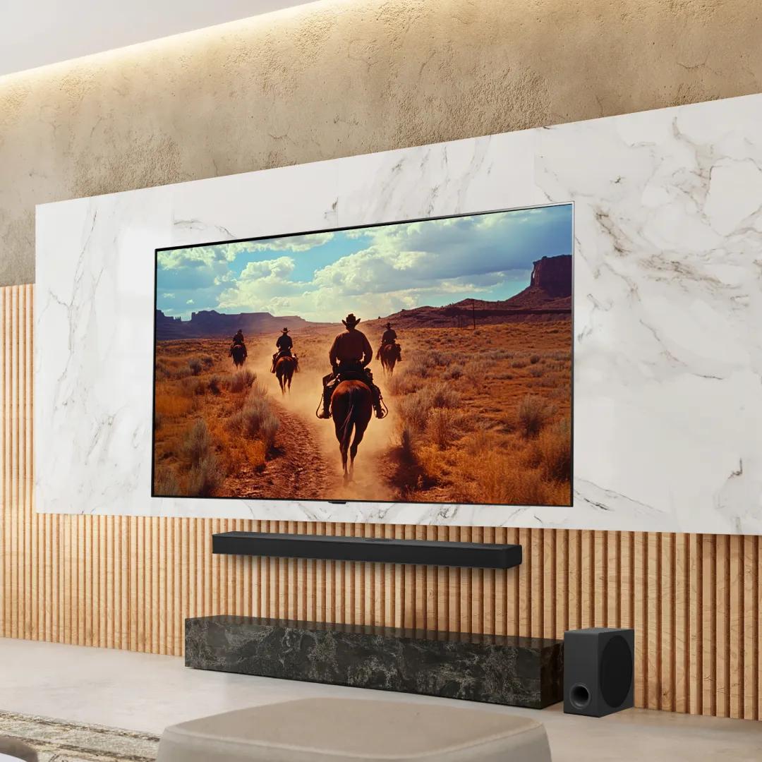 An LG TV in a stylish living room displays a scene from a Western. 