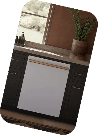 LG SIGNATURE dishwasher built into dark cabinetry with brass handles, below a window with a potted plant on the counter.