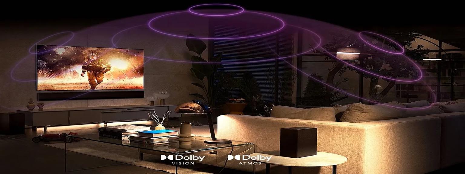  A cozy living room featuring an LG TV with Dolby Vision and Dolby Atmos, showing a cinematic scene of a firefighter running through flames, with purple sound waves illustrating an immersive audio experience.
