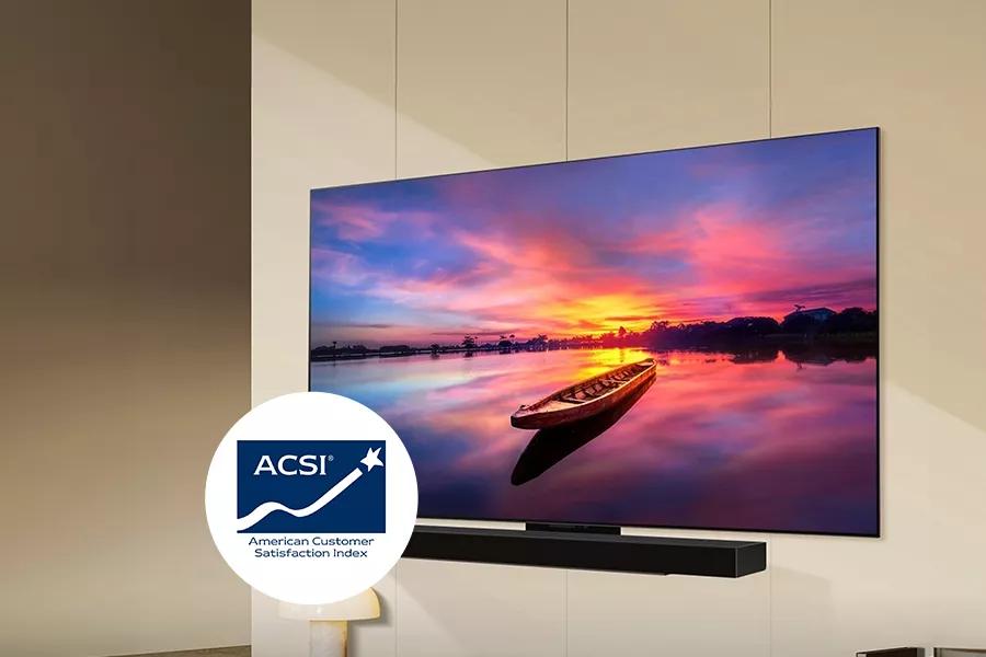 The LG LR65 TV against a wall, featuring a lake at sunset with the ACSI logo.