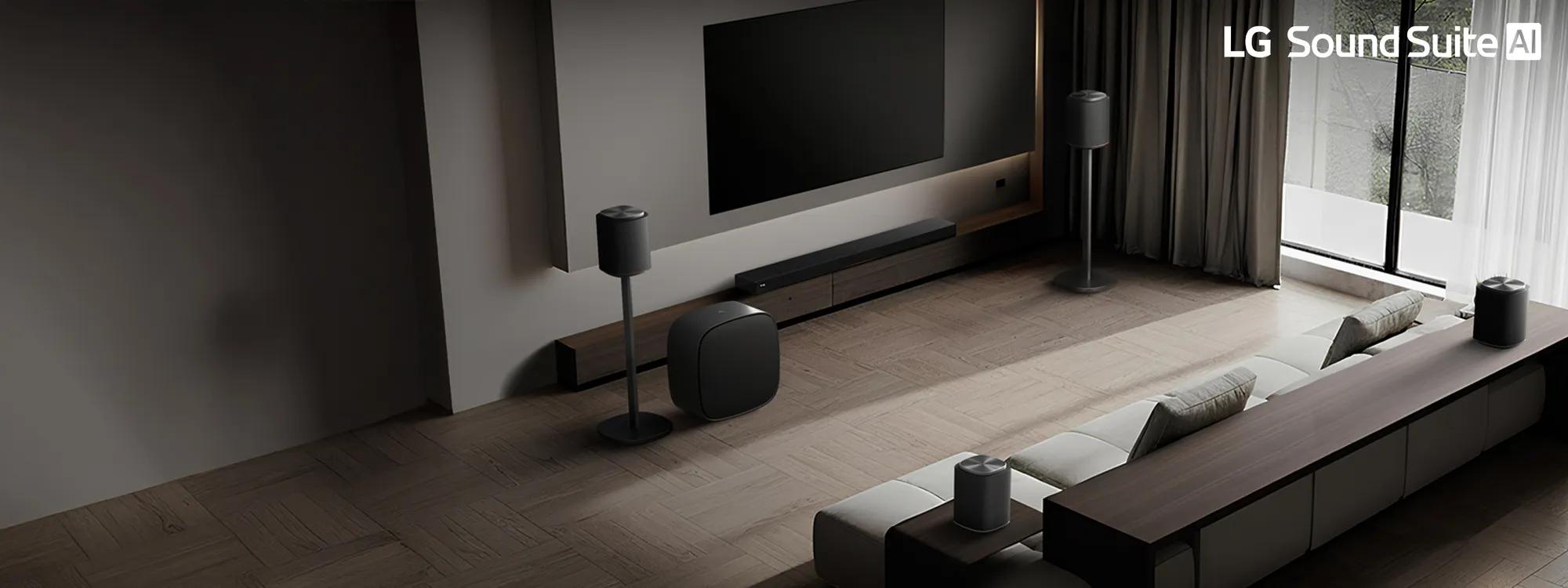 Modern living room with LG Sound Suite, wall-mounted TV, soundbar, subwoofer and rear speakers around a sleek sectional sofa with soft lighting.