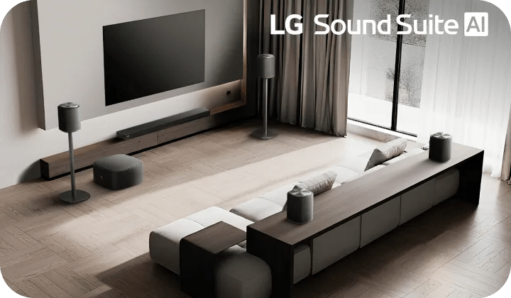 Modern living room with wall-mounted TV, LG soundbar and speakers, sectional sofa, light wood floors, sheer curtains, and “LG Sound Suite AI” text.