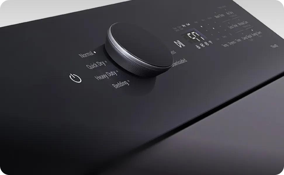 A close-up shot showcases an LG top load dryer's LCD display and control knob, including various settings and cycles.