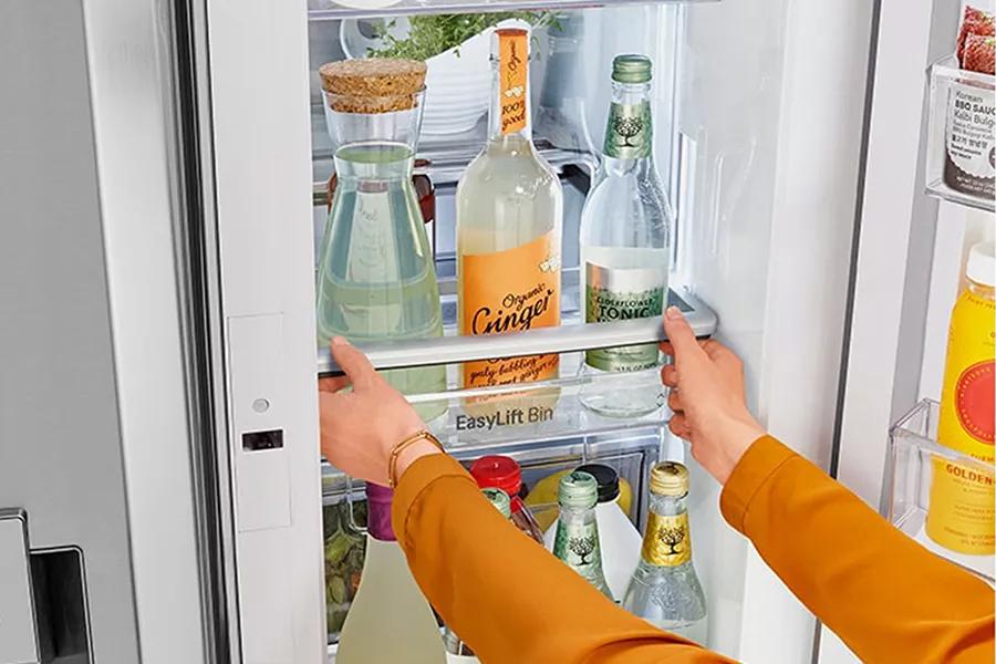 Refrigerator interior showcasing Adjustable Door In Door Bins