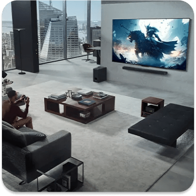 Man and dog in an ultra-modern high-rise living room with the man gaming through a console wirelessly connected to a wall-mounted LG TV.