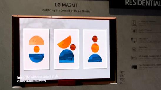 LG residential MAGNIT display mounted on a wall displaying bright geometric modern art. 