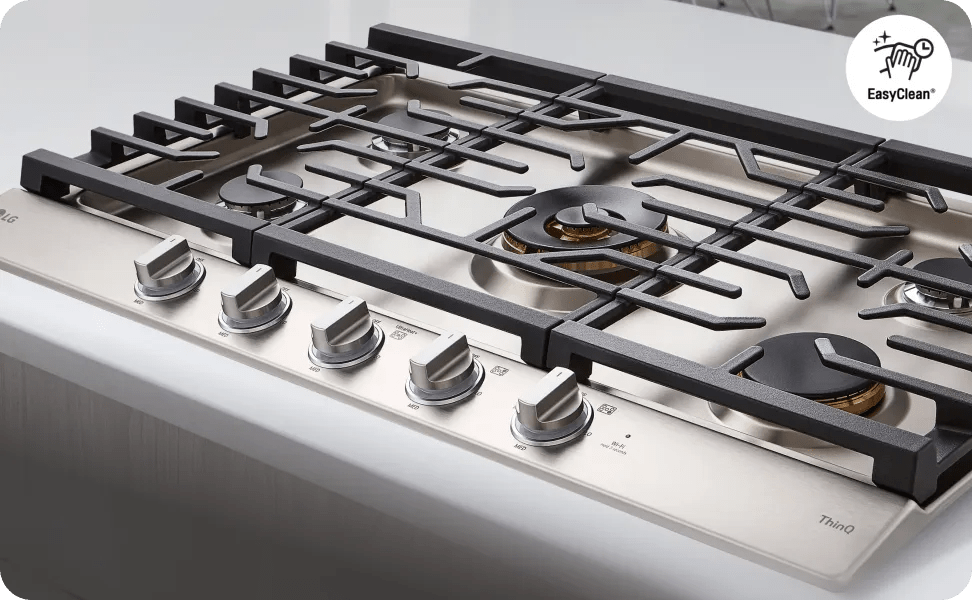 A clean, overhead shot of a stainless steel LG gas cooktop.