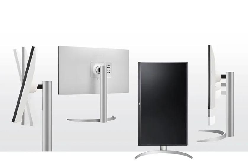 Computer monitor shown in multiple angles with an adjustable silver stand.