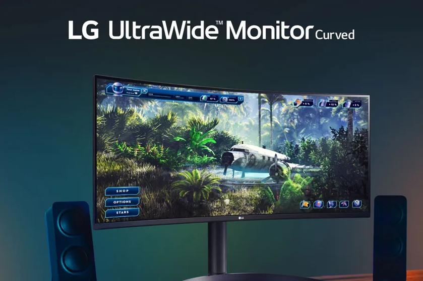 Curved LG UltraWide monitor displaying a jungle video game scene, with speakers on either side.