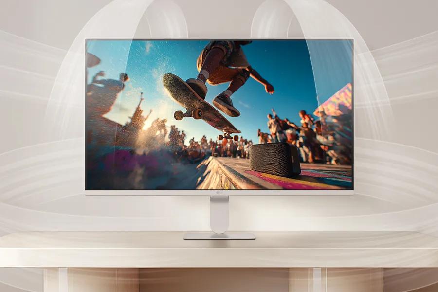 27U511SB-W Monitor with fine-tuned features displaying skateboarding action scene with built-in speaker