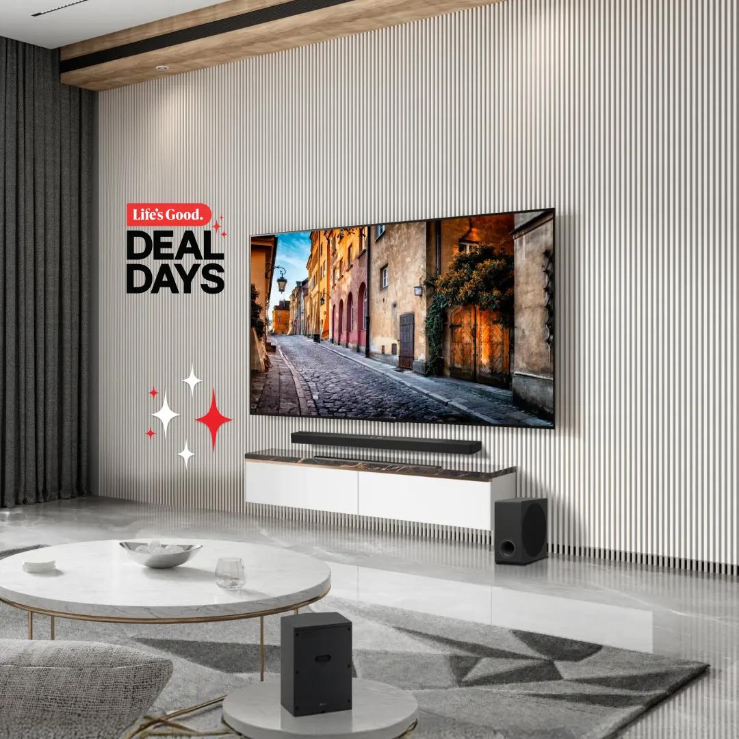 LG Deal Days lifestyle promotional image featuring an LG TV displaying a European cobblestone street scene, paired with an LG soundbar and subwoofer in a modern minimalist living room.