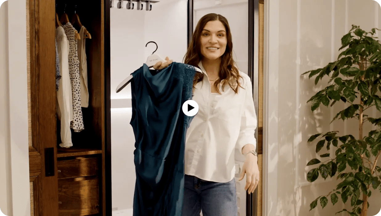 A screenshot from a video showcases a woman holding a green dress in front of an LG Styler®.