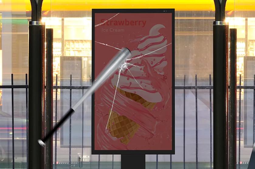 A baseball bat striking a digital advertisement screen for strawberry ice cream, causing cracks.