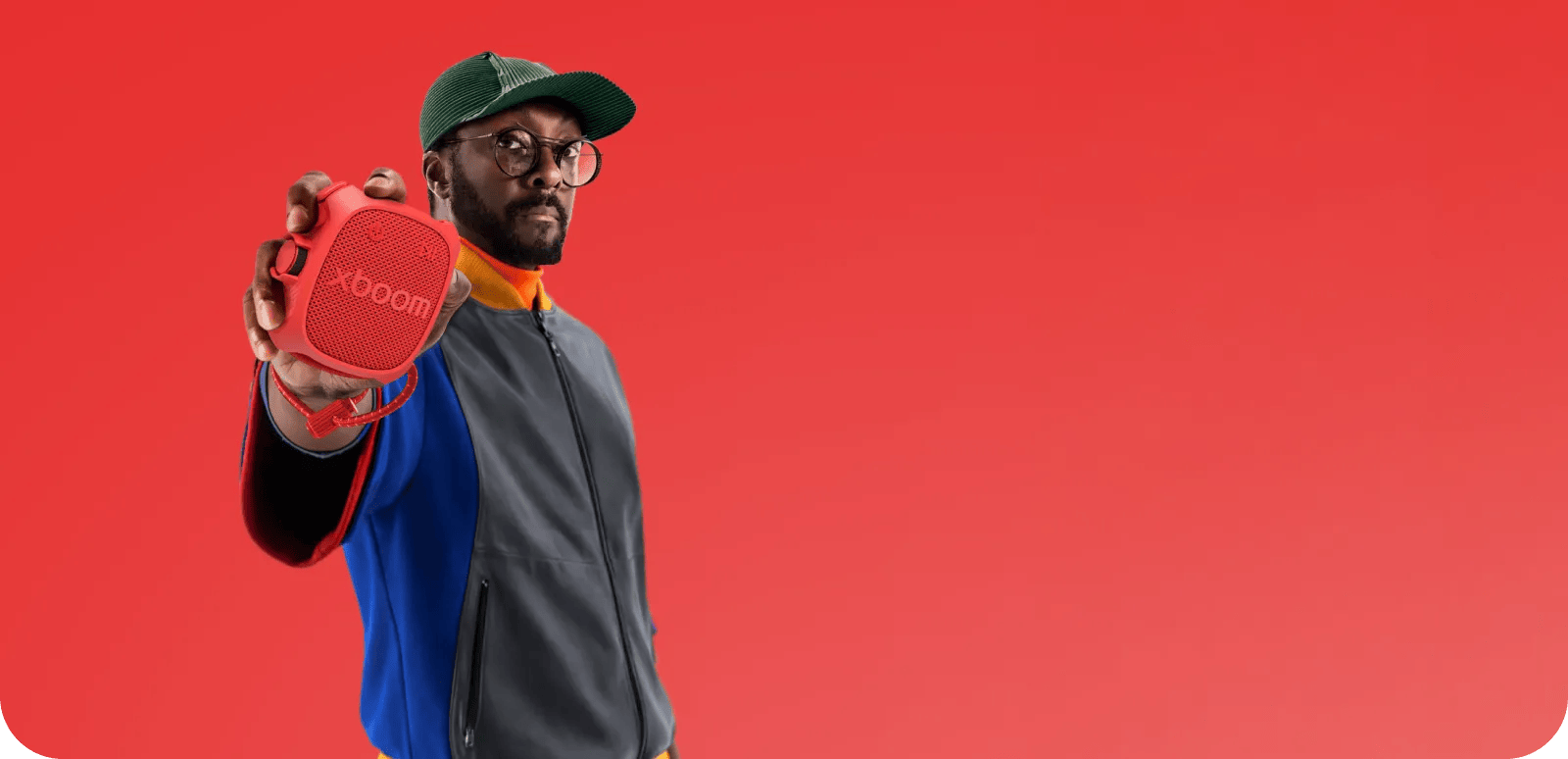 Will.i.am holiding an xboom speaker