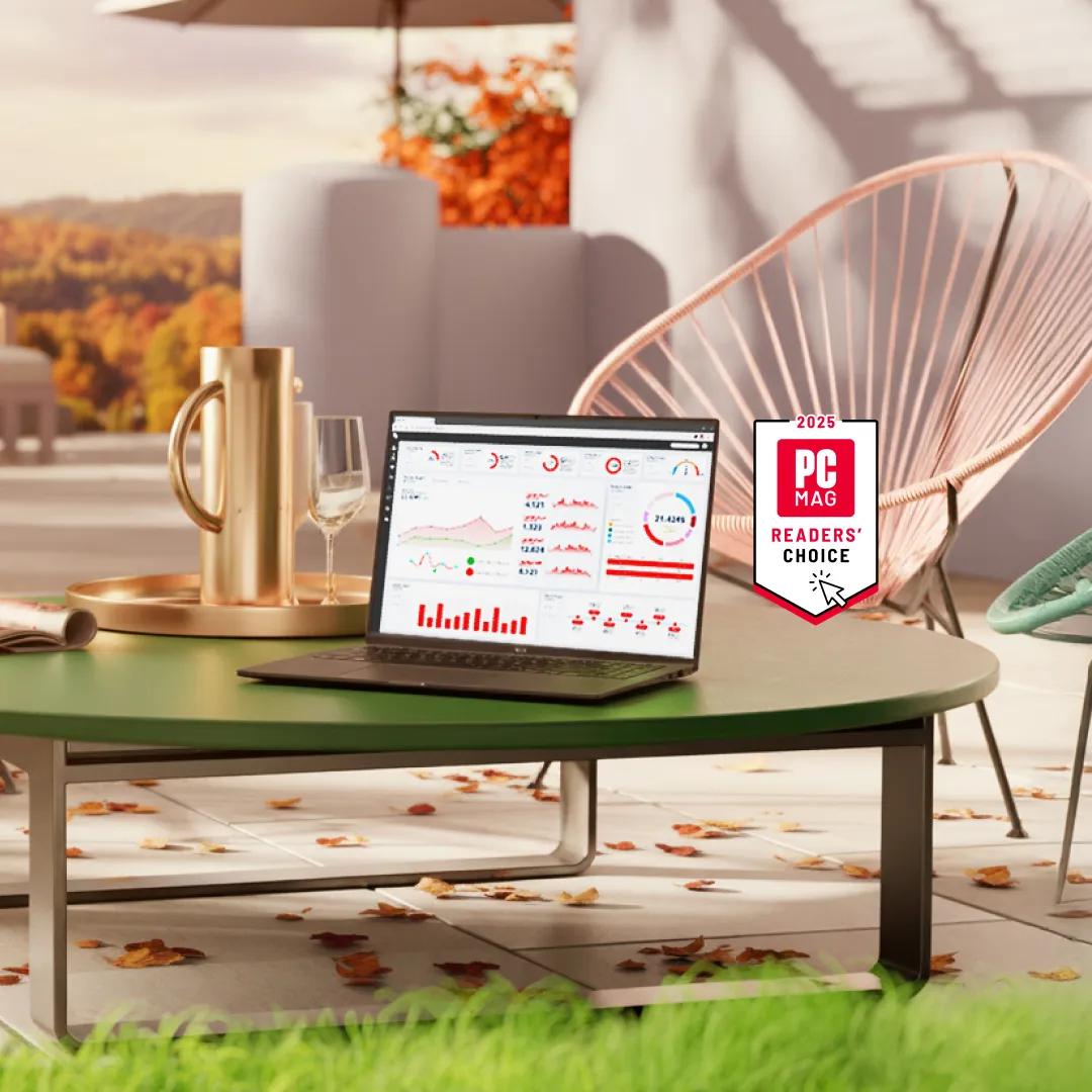 An LG laptop on a table in an outdoor setting. “2025 PC Mag Readers’ Choice” badge.