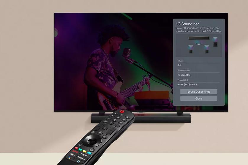 A remote pointed at the LG UT8000 screen, featuring the LG SoundBar settings interface, with the soundbar underneath.