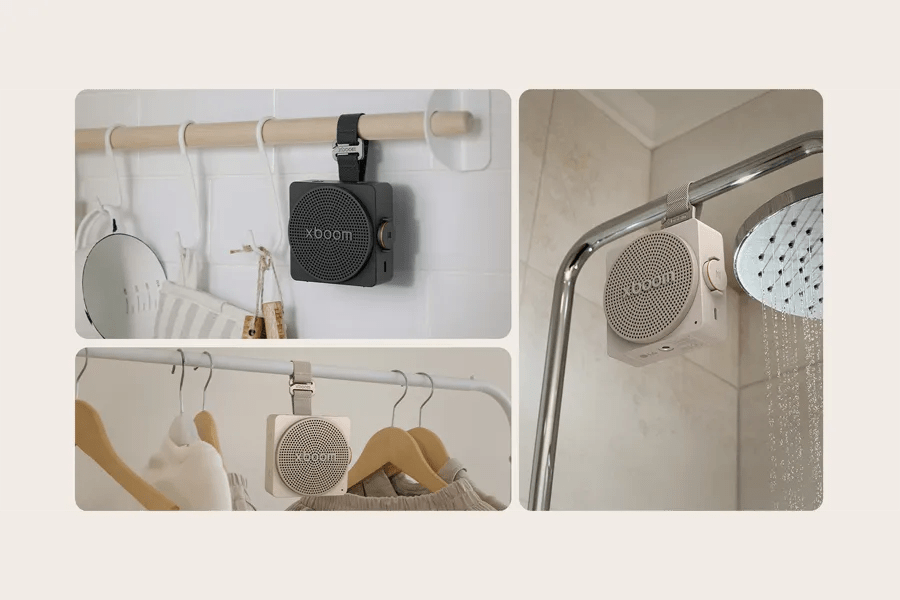 MINI_ANOALBK portable speaker showing versatile mounting options on bathroom rod, clothing rack, and shower head for convenient use in multiple locations