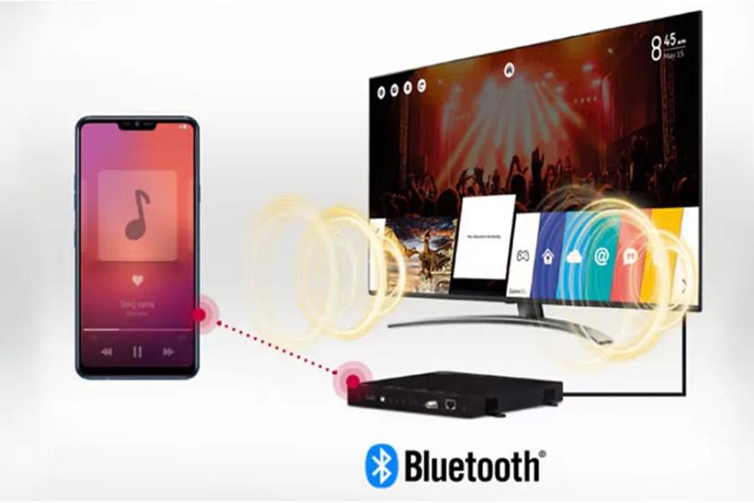 Smartphone connecting to a television via Bluetooth and top box, showing music and concert imagery.