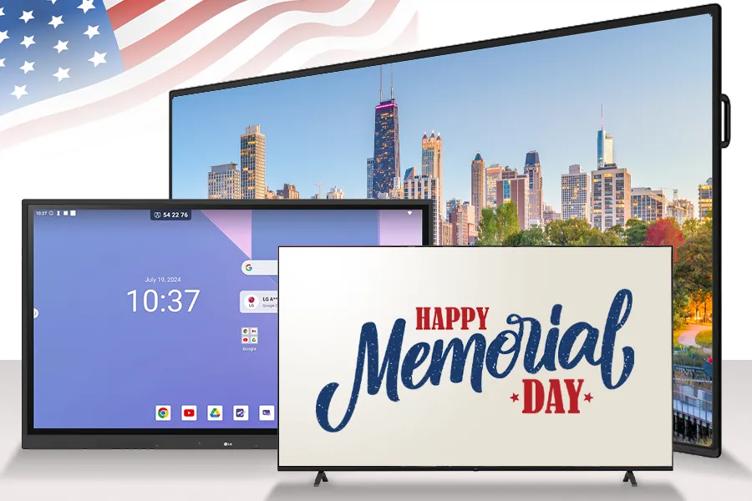 An LG Ultra Stretch Signage, CreateBoard smart board, and professional TV sit before a graphic of a waving American flag. The TV displays red and blue text that says Happy Memorial Day.