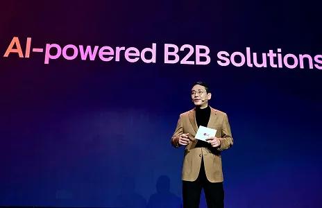 Speaker presenting AI-powered B2B solutions on stage at LG event.