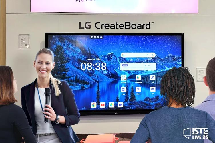 A presenter standing in front of an LG CreateBoard, holding a microphone and smiling at the small crowd assembled before her.