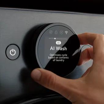 Hand adjusting AI Wash cycle on LG washing machine using smart control dial.