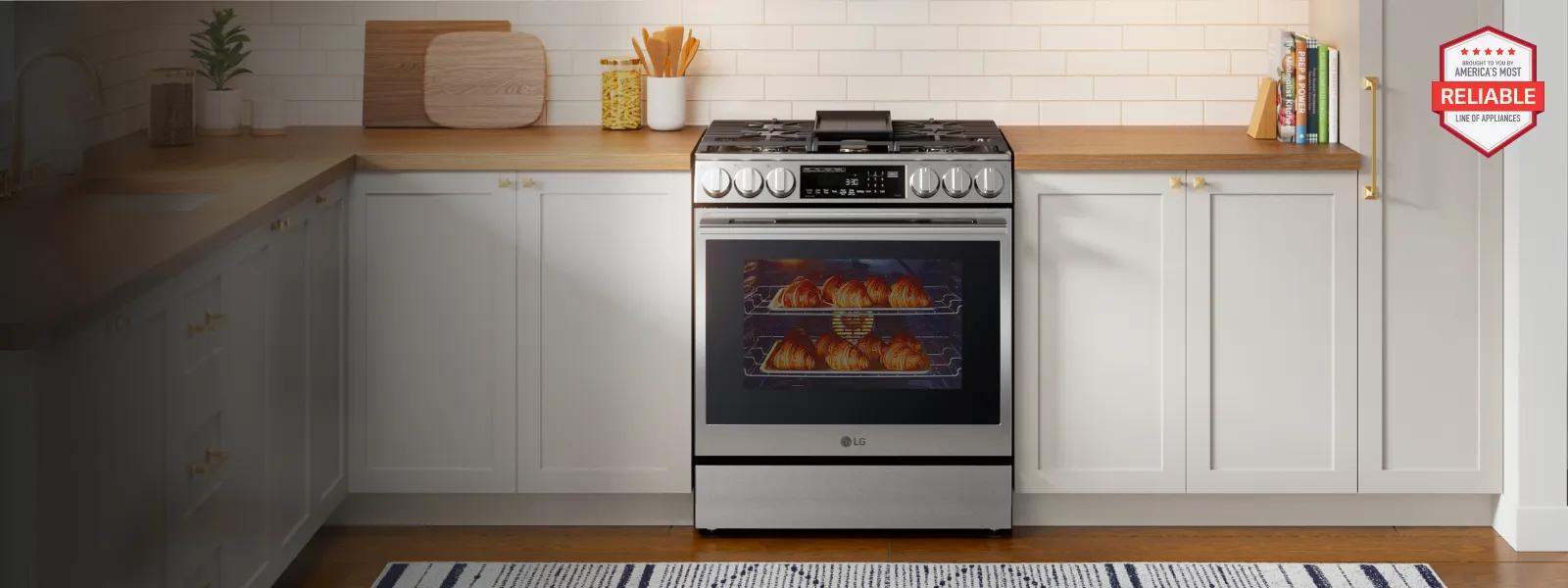 LG stainless steel gas range with griddle, front knobs, and digital display, set in a modern kitchen with white cabinets and wood counters. A red hexagonal badge reads 'Brought to you by Americans Most Reliable Line of Appliances' with five red stars at the top.